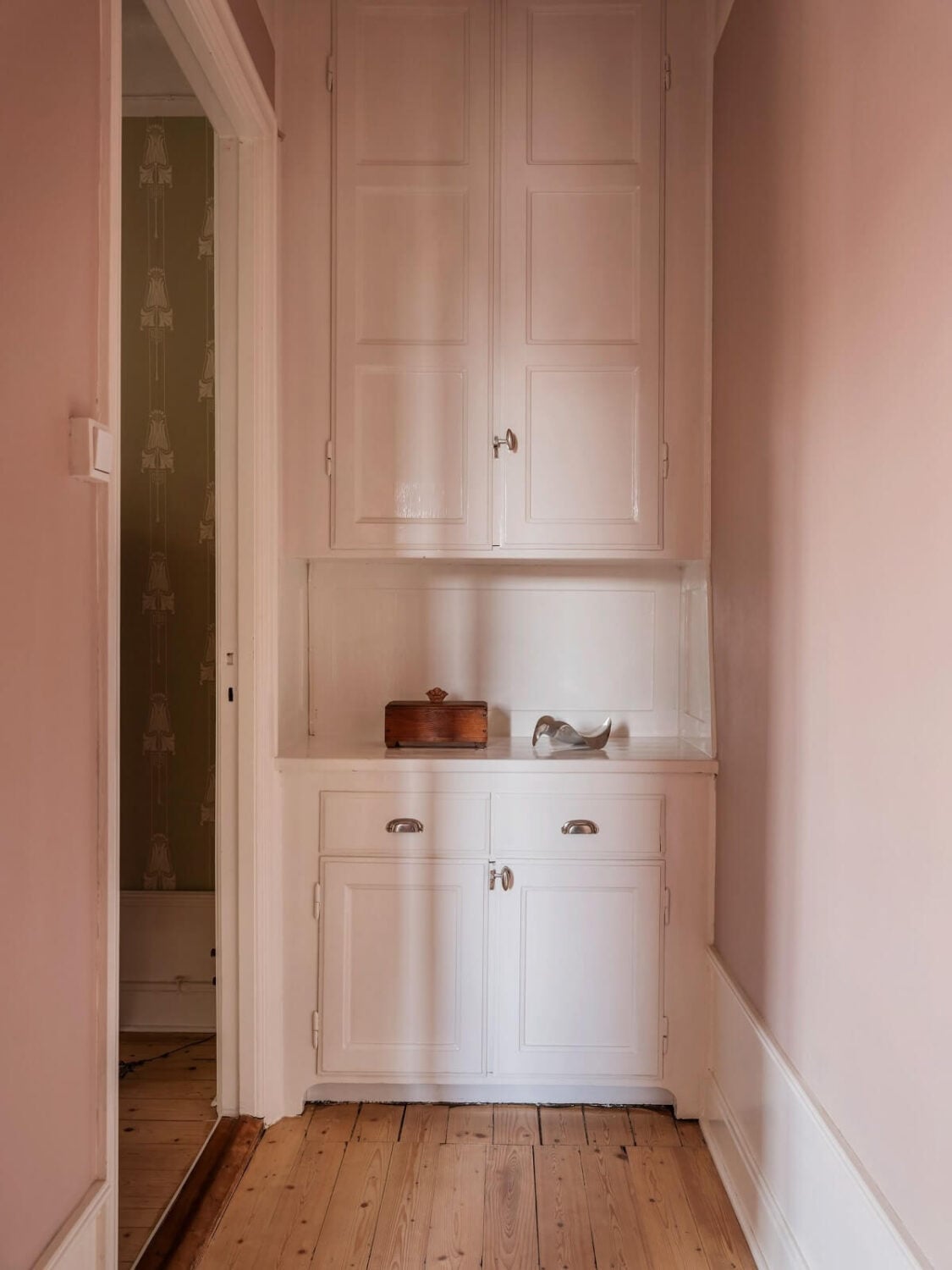 A Living Room with Light Purple Walls in a Swedish Apartment 10 pink hall with original cabinet