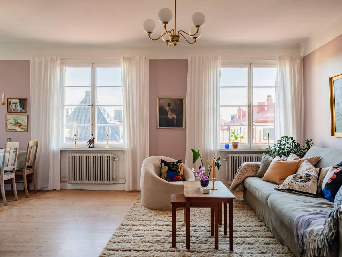 A Living Room with Light Purple Walls in a Swedish Apartment 3 pink living room with large windows