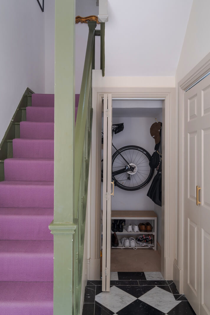 A Colorful Edwardian Family Home in London 11 pink staircase and checkerboard floor