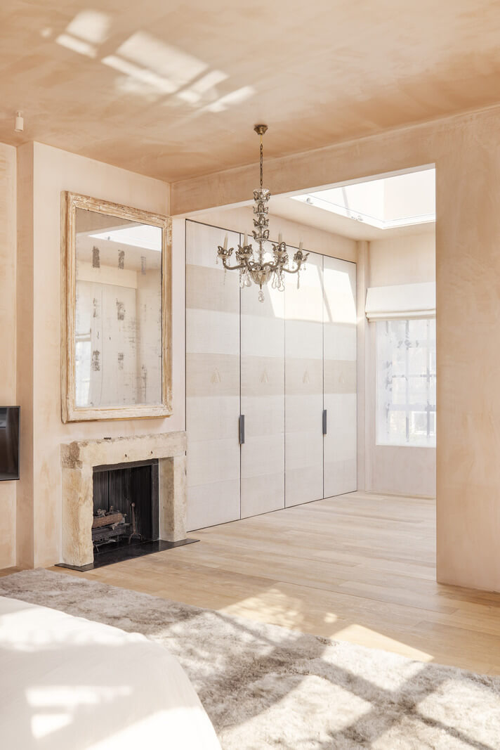 A Grand Industrial Warehouse Conversion in London 28 plaster walls master suite with fireplace A Grand Industrial Warehouse Conversion in London