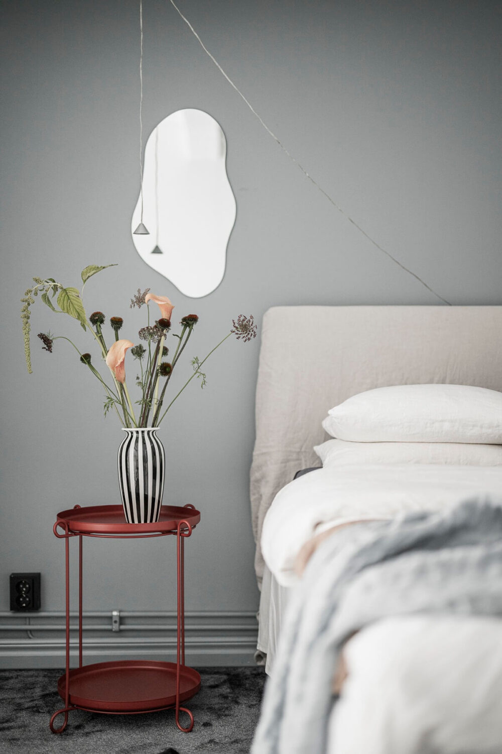 A Scandinavian Loft in an Old Industrial Building 18 red bedside table