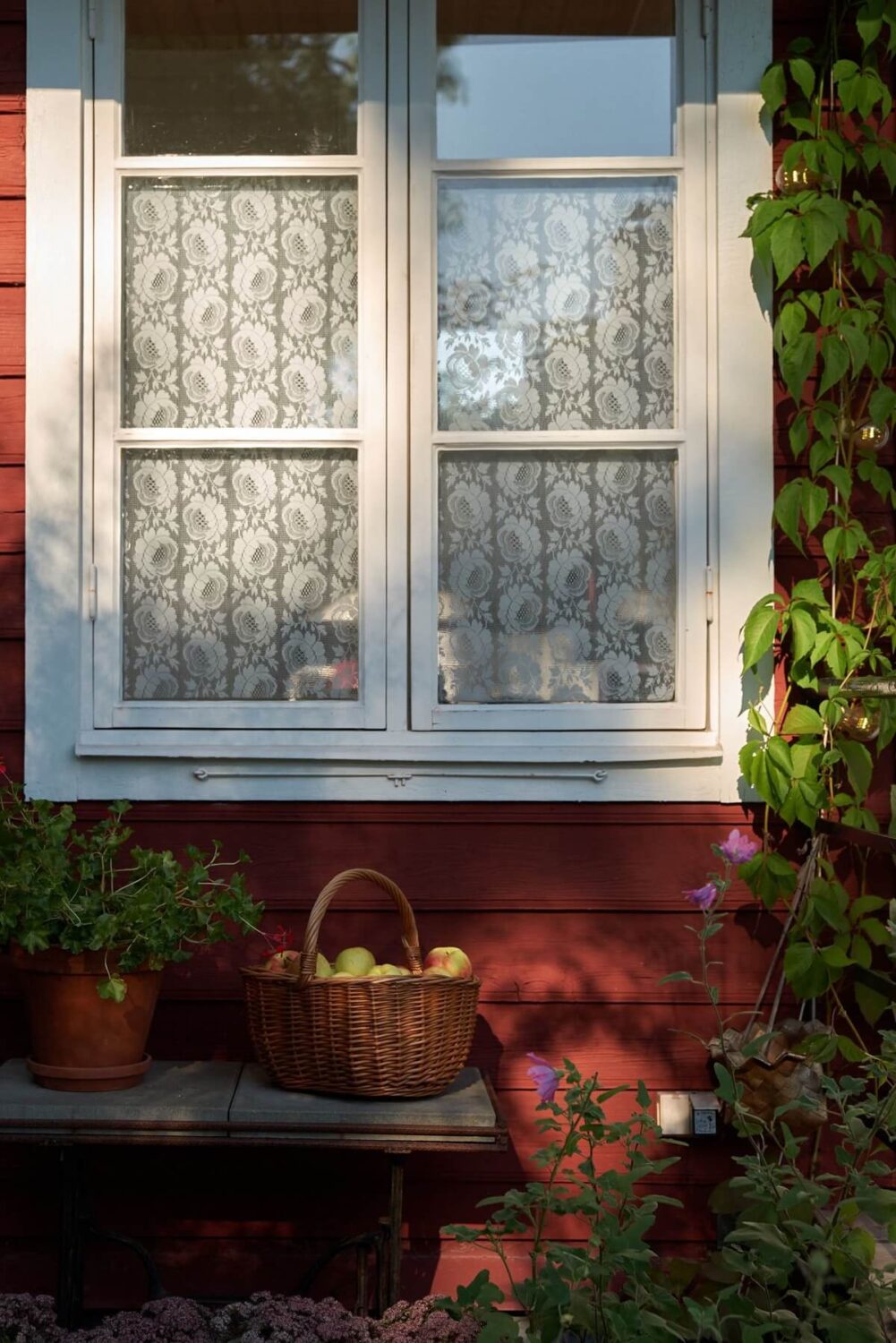 A Charming Swedish Cottage Filled with Art and Color 23 red swedish cottage window