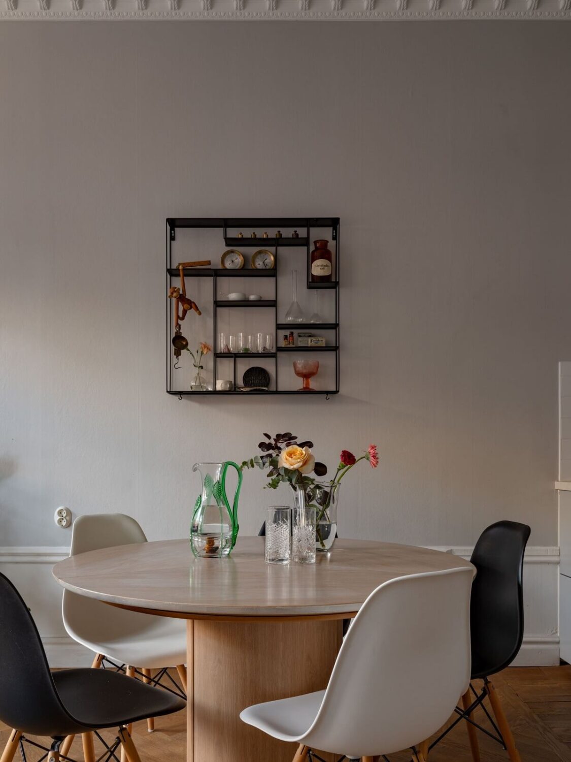 An 1890s Stockholm Apartment with a Blue Bedroom 5 round dining table with black and white chairs