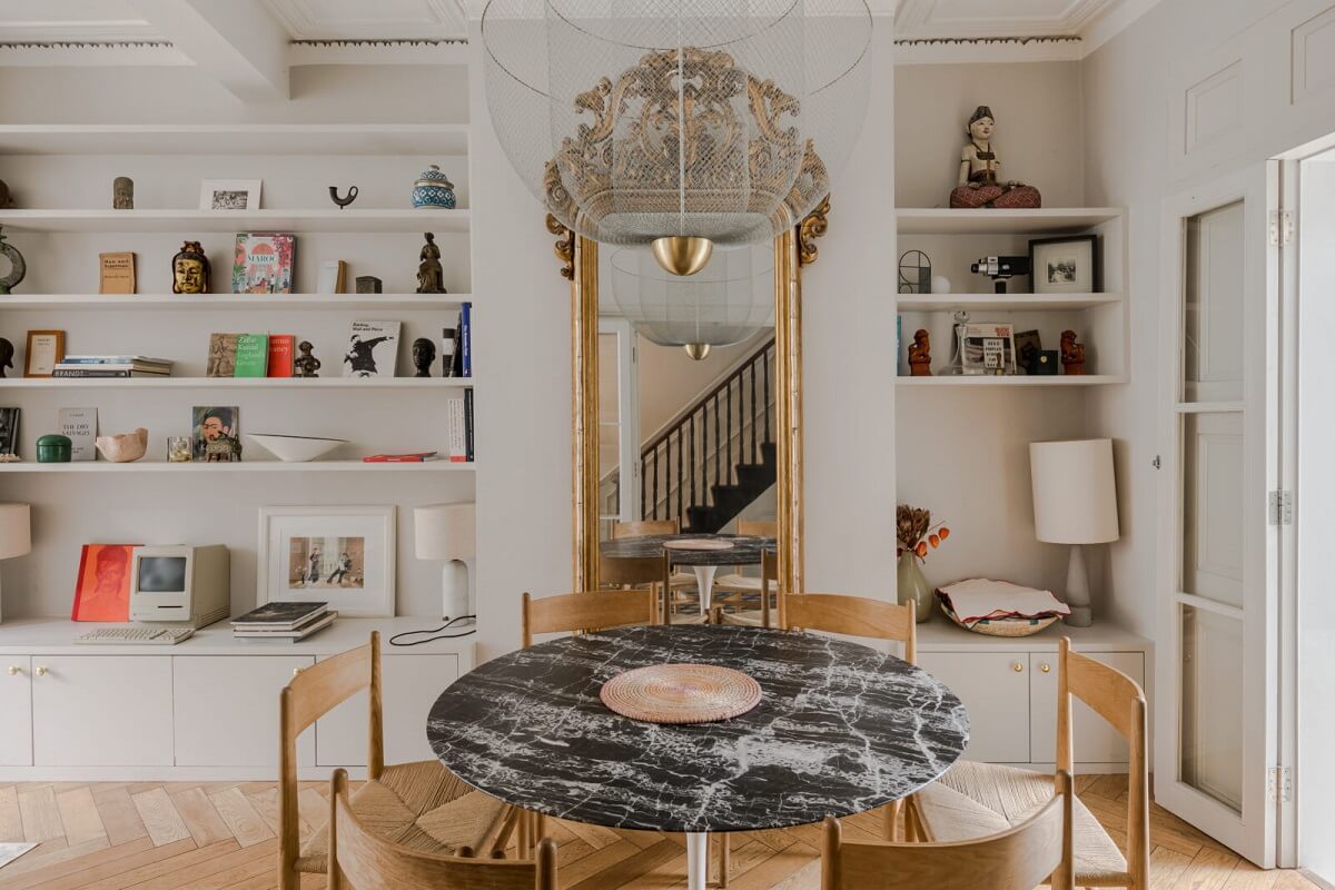 A Bright Extended and Renovated Victorian House in London 3 round marble dining table and built in shelves