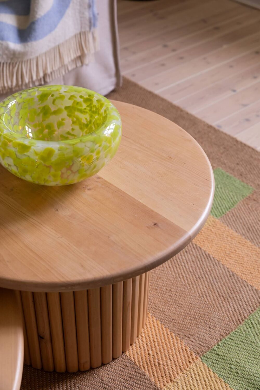 Soft Colors in a Charming Corner Apartment in Stockholm 3 round wooden coffee tables