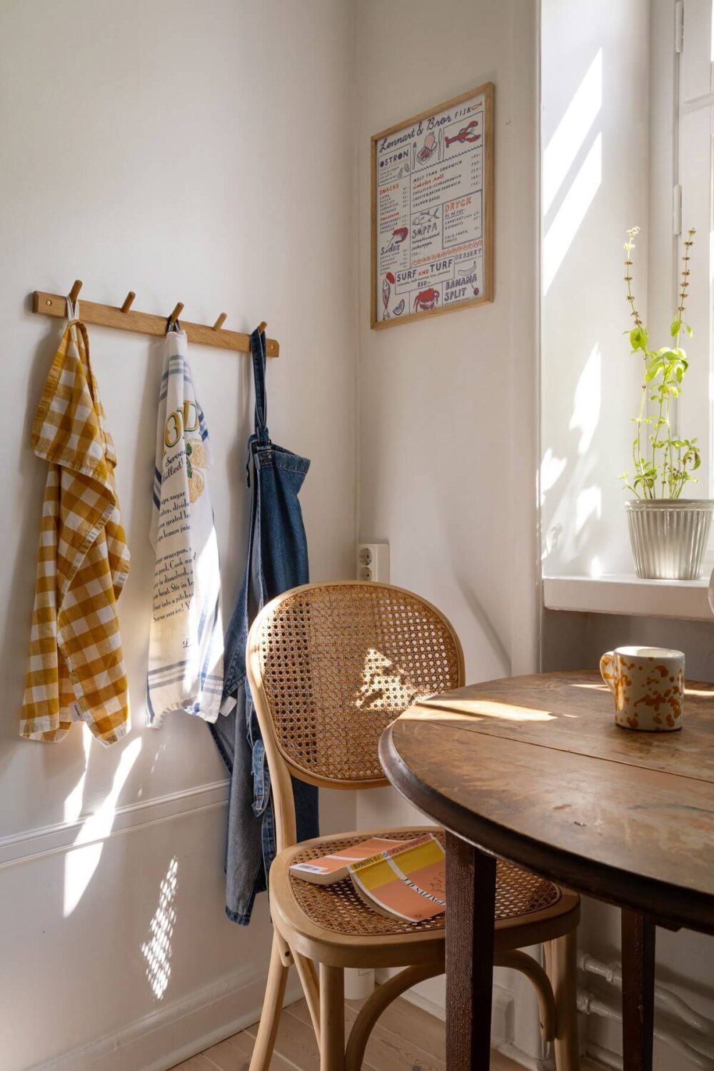 Soft Colors in a Charming Corner Apartment in Stockholm 18 round wooden kitchen table