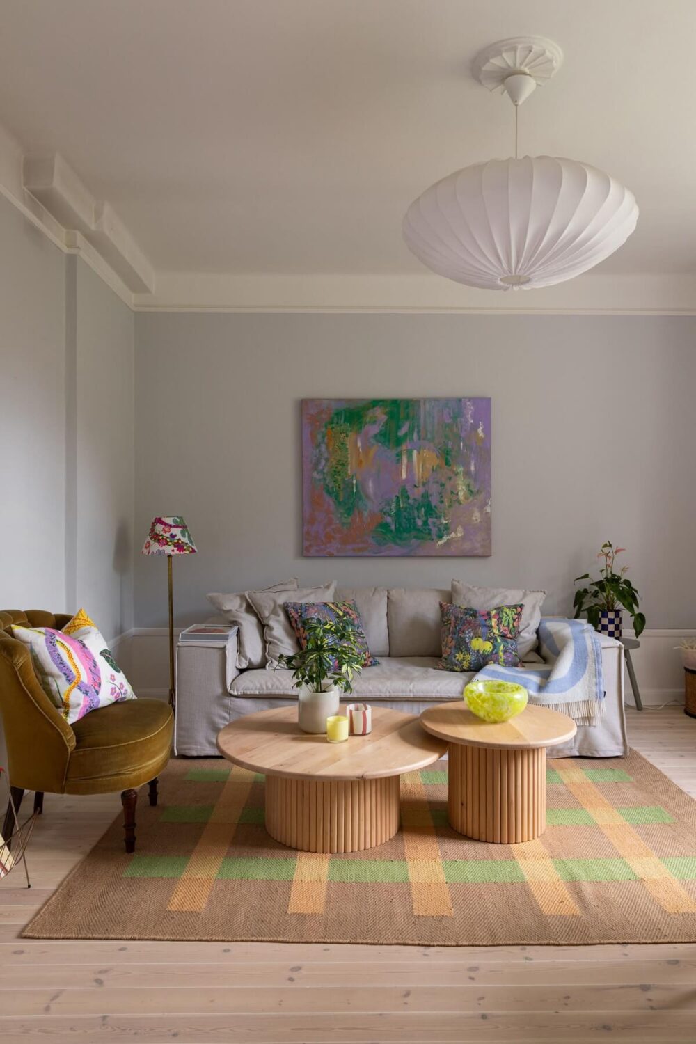 Soft Colors in a Charming Corner Apartment in Stockholm 4 scandi living room ochre yellow accent chair