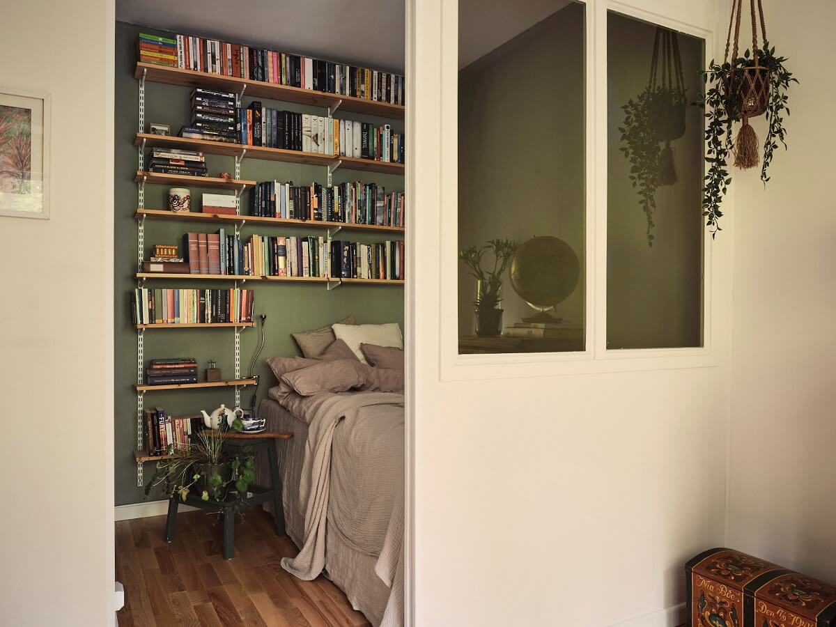 A Small Swedish Apartment with a Social and Semi-Open Floorplan 9 semi open bedroom with green walls