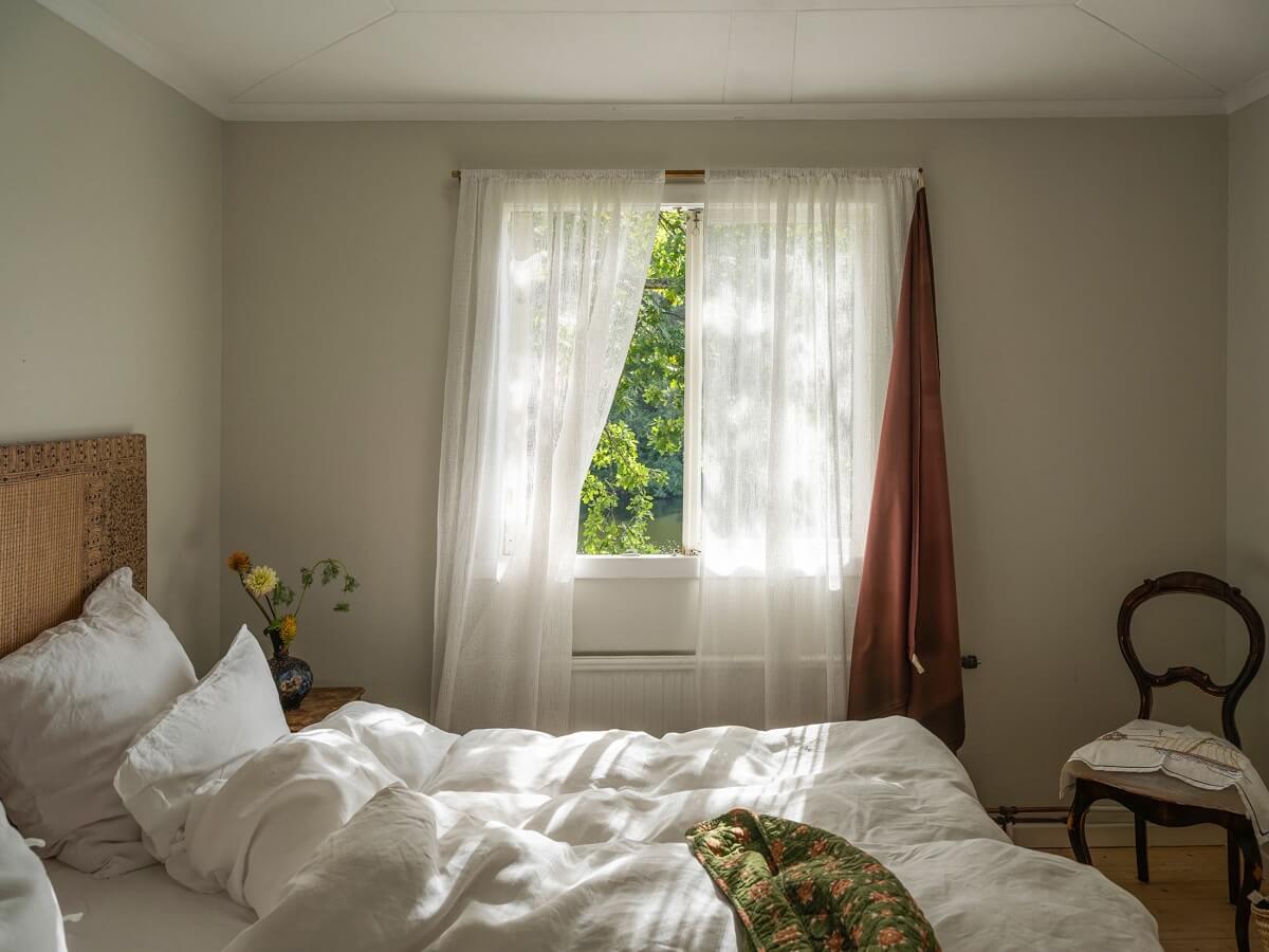 A Romantic 1920s Villa with Views of the Lake 16 serene bedroom