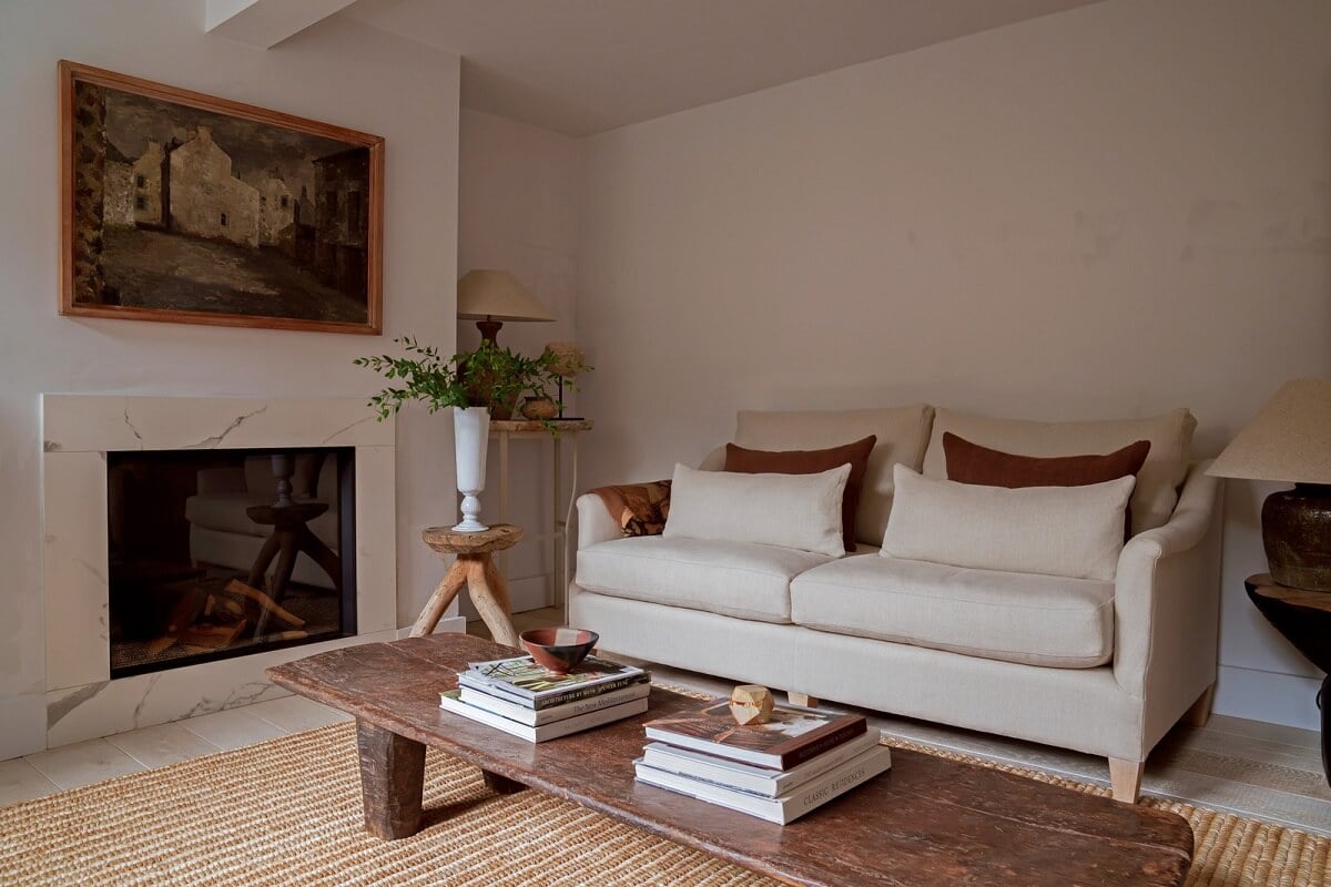 Contemporary Light Interiors in a 19th-Century English Cottage 2 serene living room jute rug fireplace