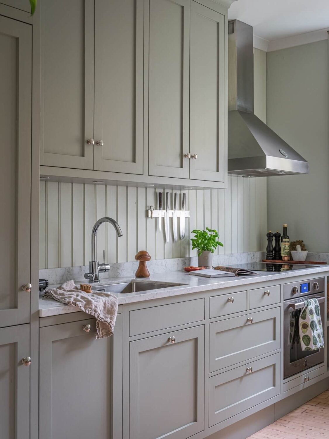A 1930s Apartment with Gray Rooms and Period Features 8 shaker style kitchen cabinets