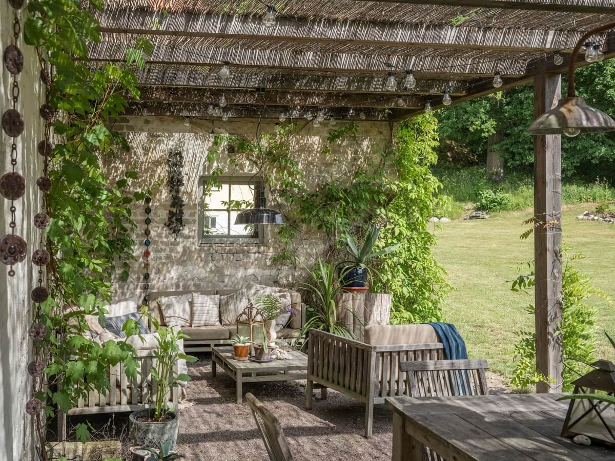 A Bohemian-Style House on the Estate of a Swedish Castle 25 sitting area pergola swedish country house