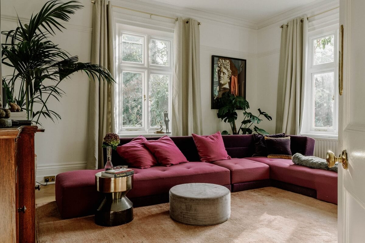 A Grand Arts and Crafts House in London 3 sitting room dark pink sofa