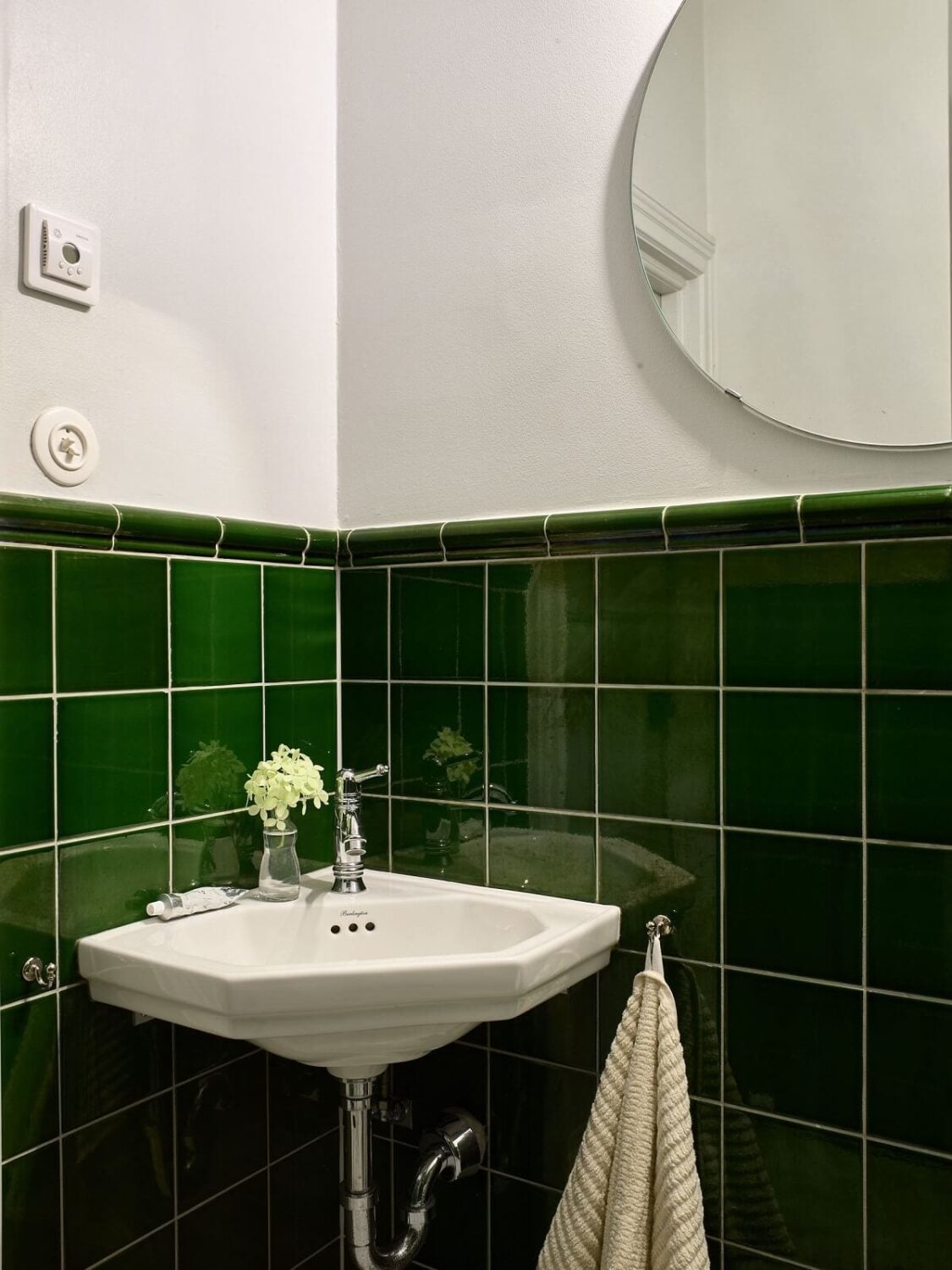 A Colorful Turn-of-the-Century Family Apartment in Stockholm 35 small bathroom dark green tiles