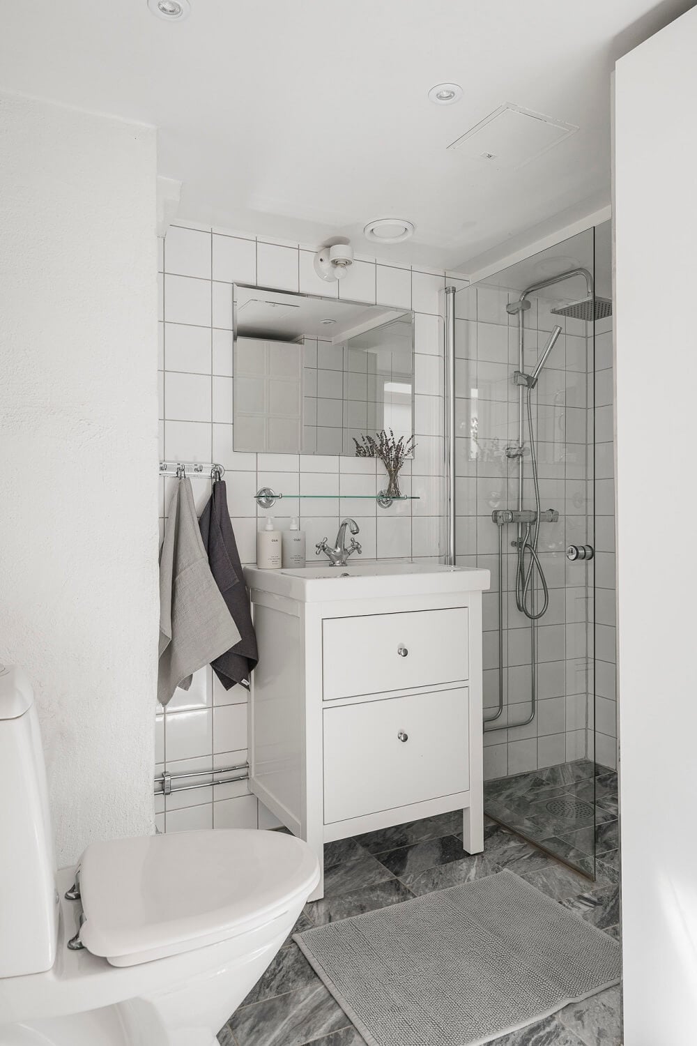 A Swedish Attic Apartment with a Lovely Balcony Overlooking the City 18 small bathroom with marble tiles A Swedish Attic Apartment with a Lovely Balcony Overlooking the City