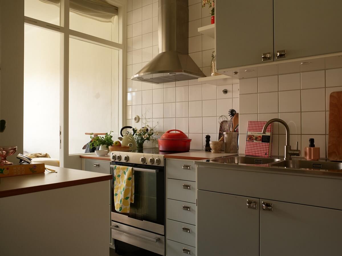 A Small 1930s Swedish Apartment with a Yellow Floral Hall 8 small gray midcentury kitchen white tiles