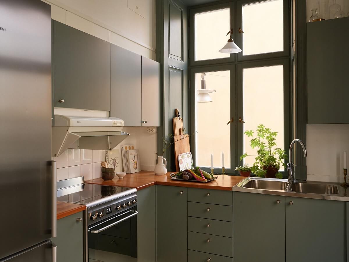A Light Corner Apartment with 1890s Period Features 12 small green kitchen
