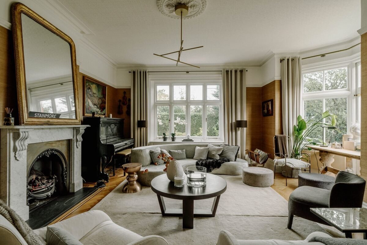 A Grand Arts and Crafts House in London 1 spacious living room rounded furniture fireplace