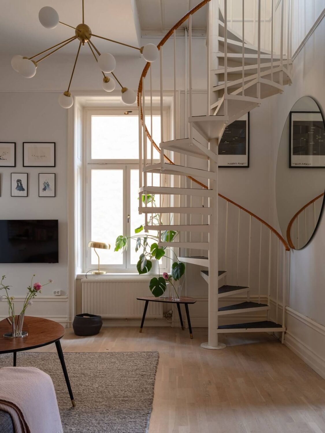 A Swedish Maisonette with Period Features and Modern Solutions 9 spiral staircase in living room