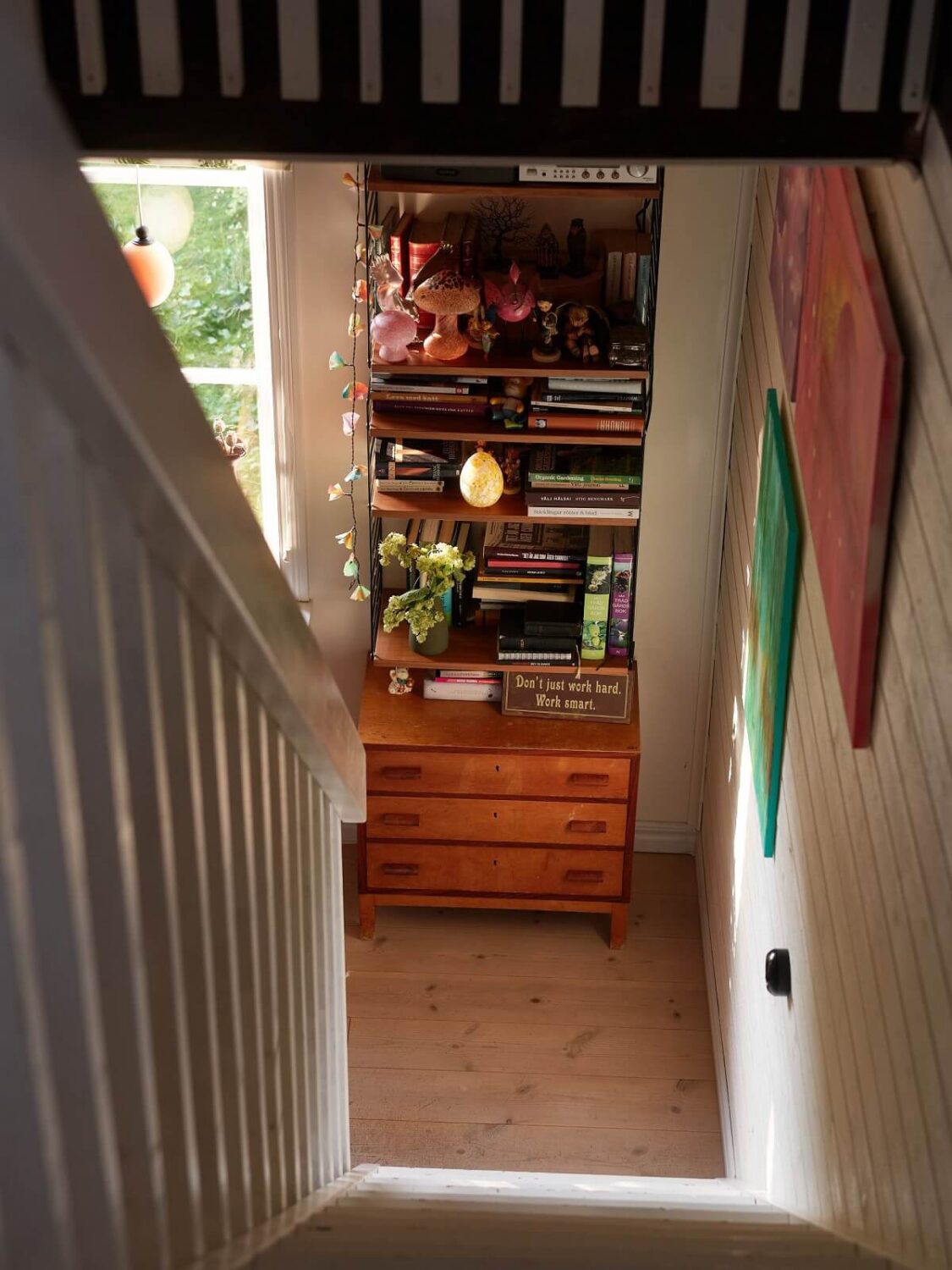 A Charming Swedish Cottage Filled with Art and Color 7 staircase