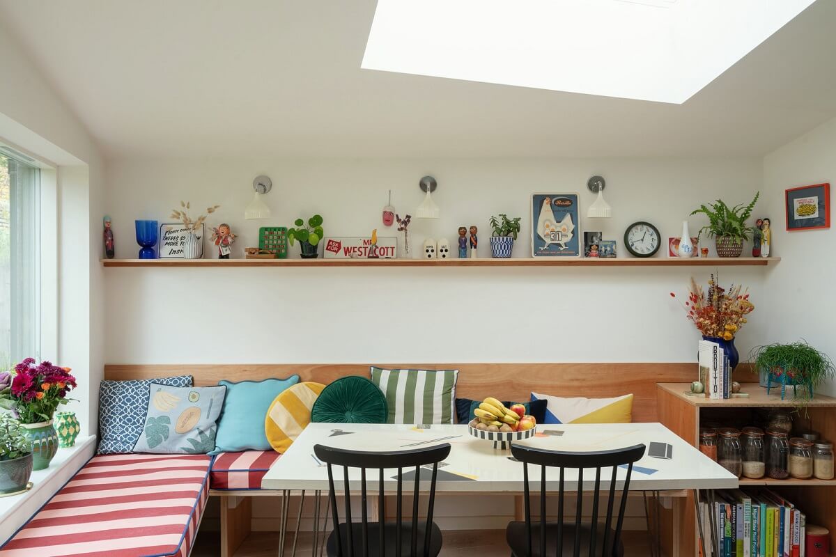 Colorful Rooms and Period Features in a London Terrace House 9 striped cushions dining bench
