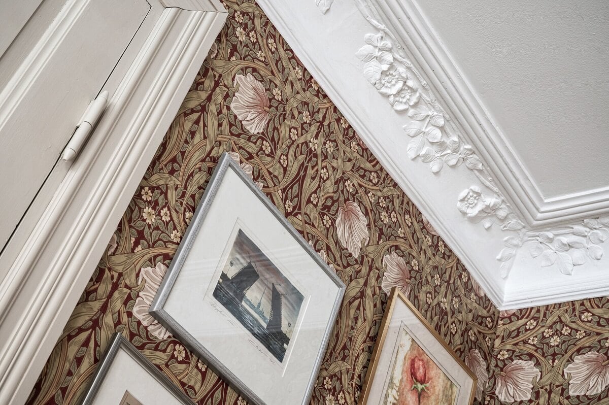 A Stately Apartment with Period Details and Wallpapers 3 stucco detail and william morris wallpaper