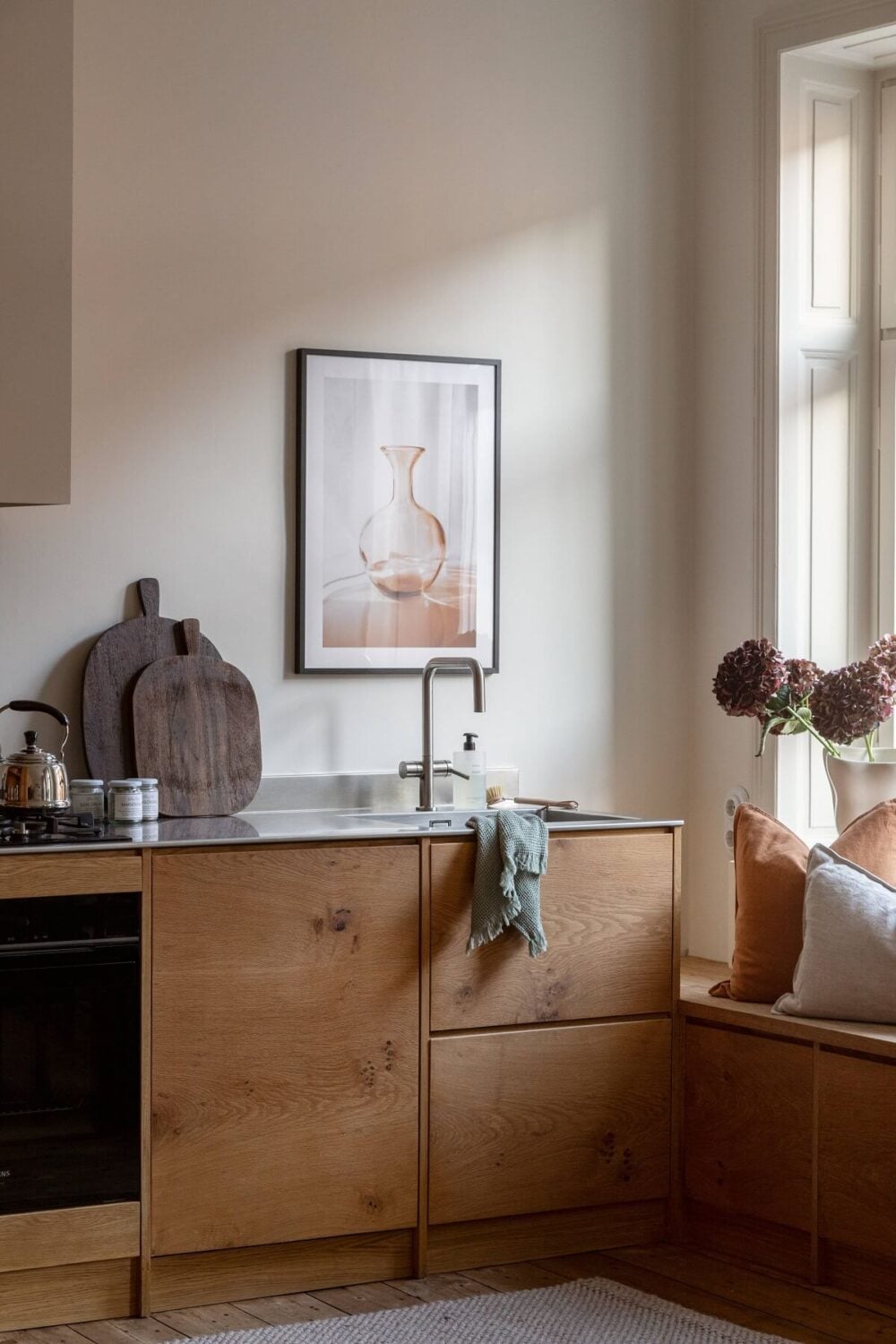A Turn-of-the-Century Apartment with Warm Open-Plan Spaces 14 stylish scandi kitchen with window seat