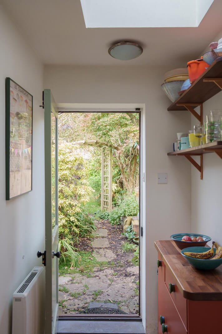 Colorful Furniture in a Historic English Cottage 9 utility room with garden access