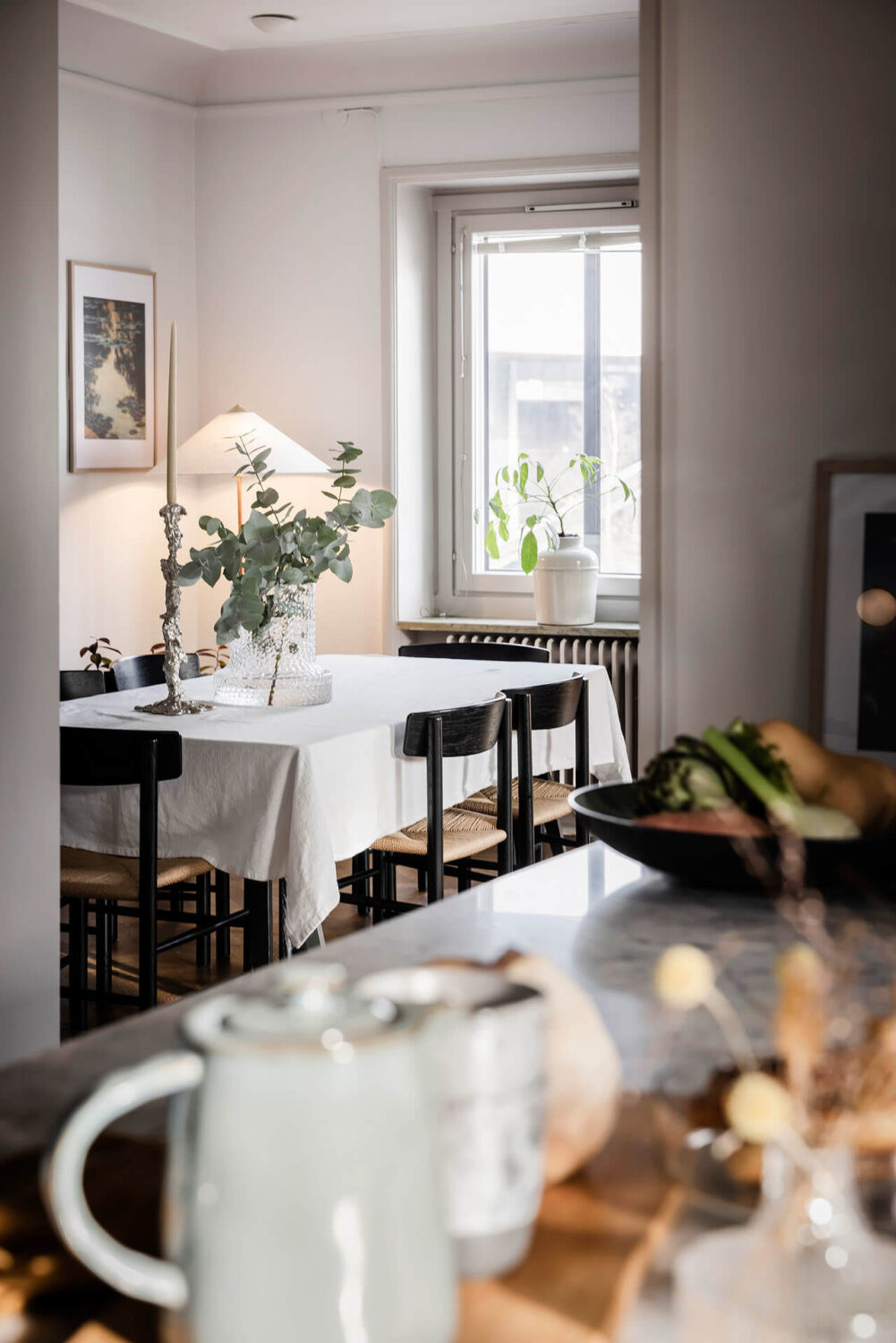 A Burgundy Kitchen in a Stylish Scandinavian Apartment 11 view into dining room