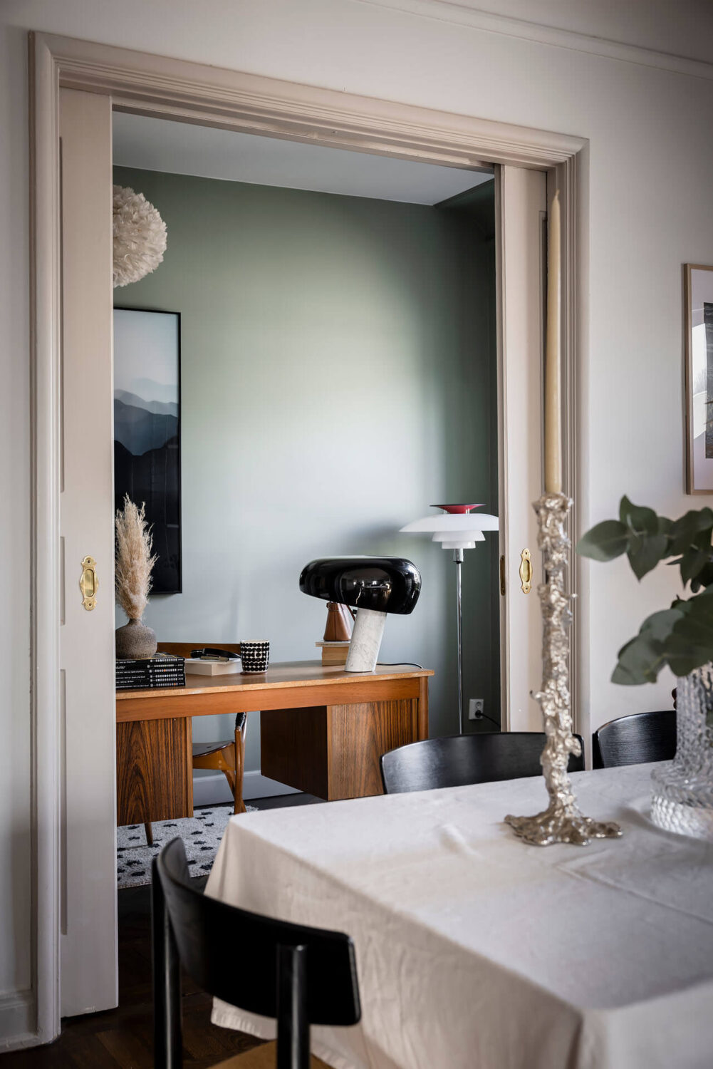 A Burgundy Kitchen in a Stylish Scandinavian Apartment 8 view into home office