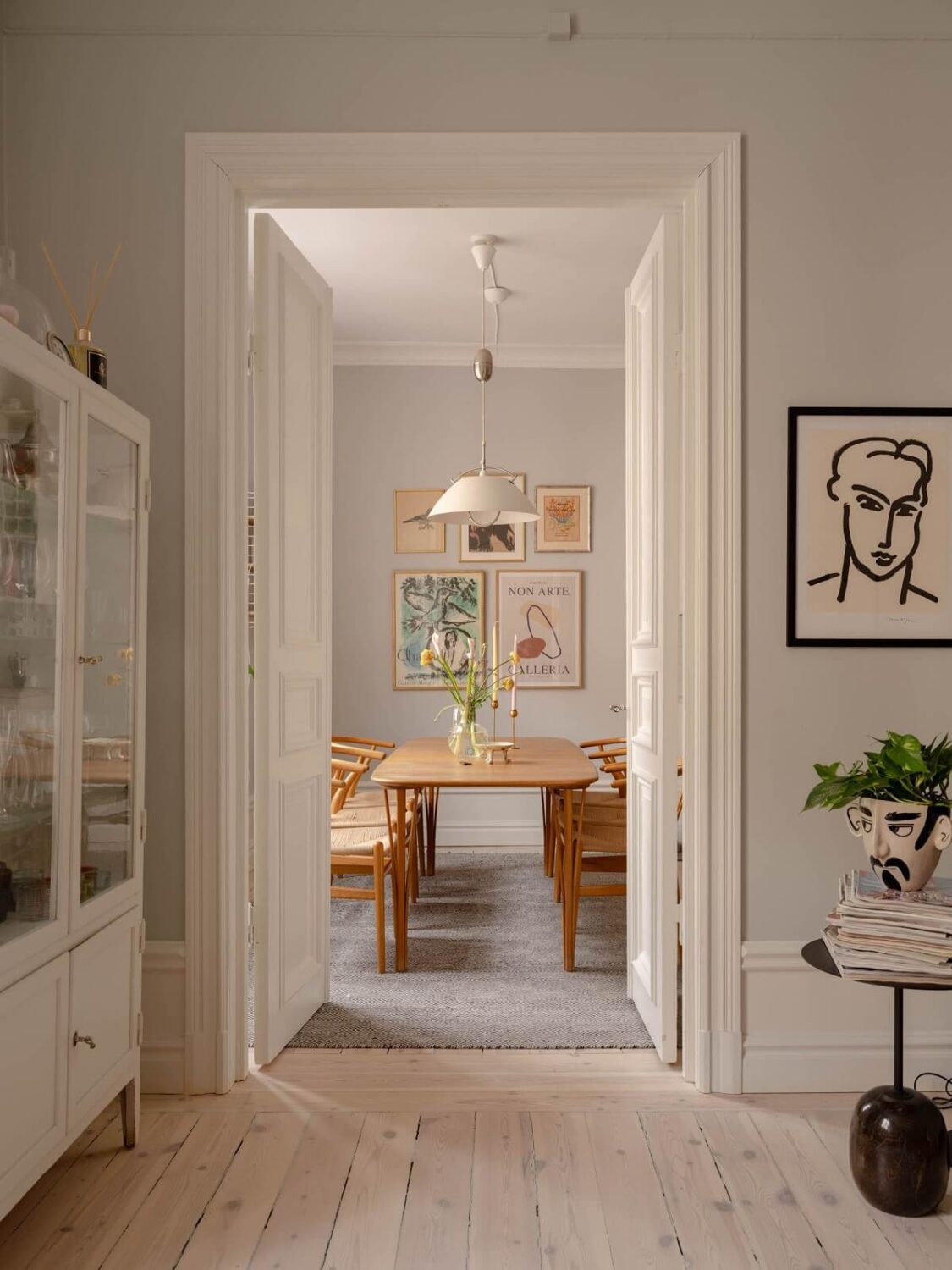 A Spacious Stockholm Apartment with Light Gray Walls 7 view into kitchen