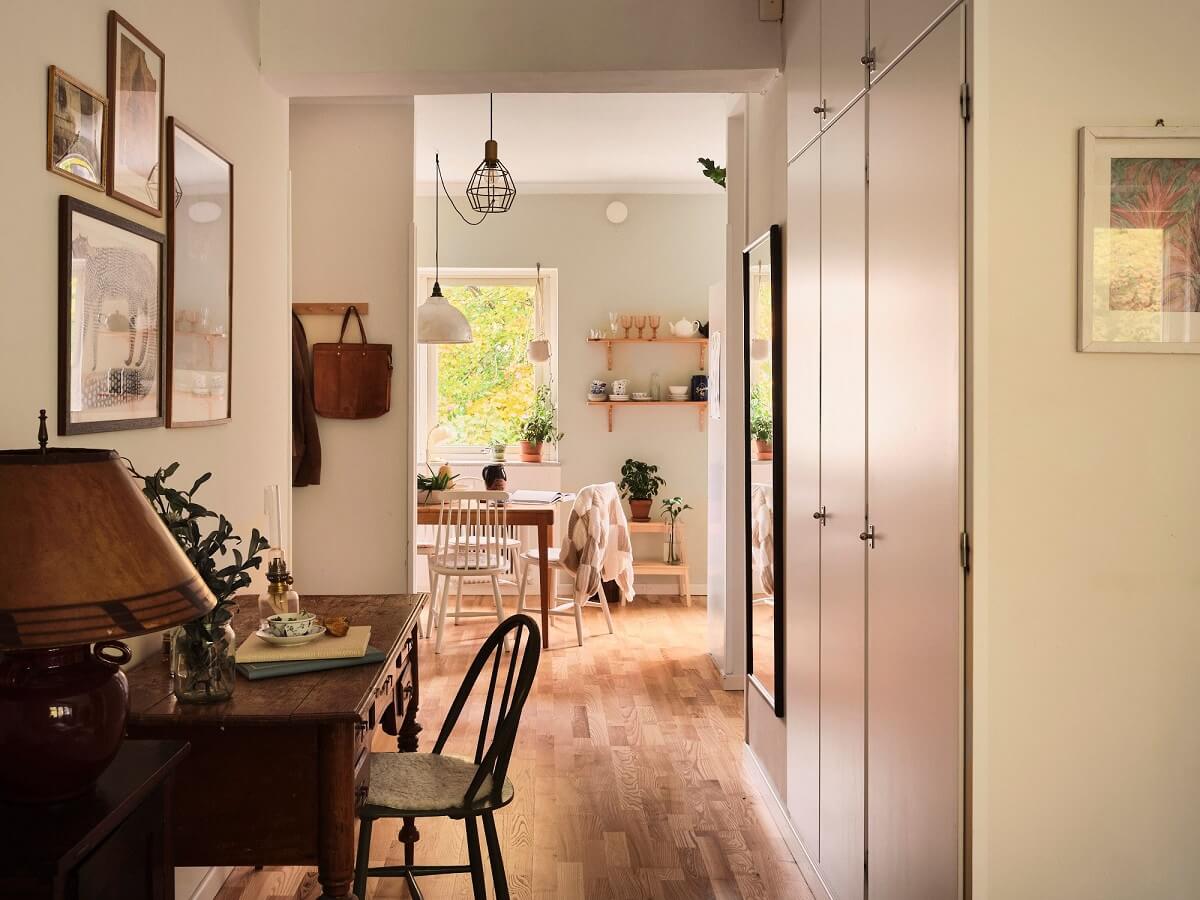 A Small Swedish Apartment with a Social and Semi-Open Floorplan 13 vintag desk built in wardrobes