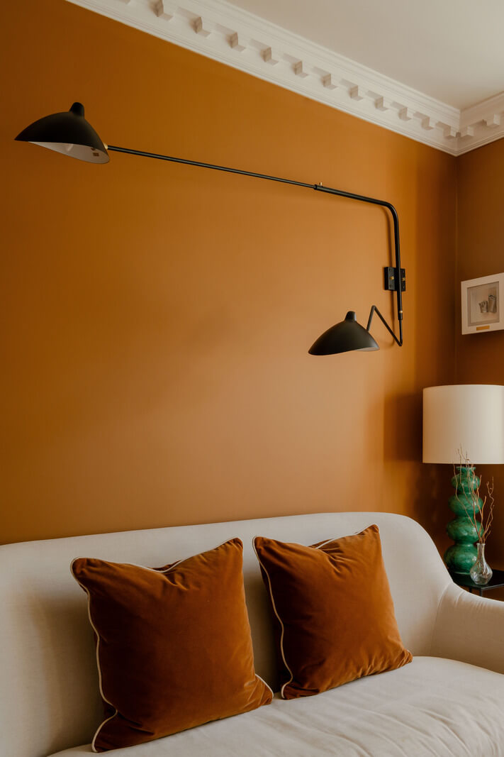 A Colorful Edwardian Family Home in London 2 warm orange walls living room