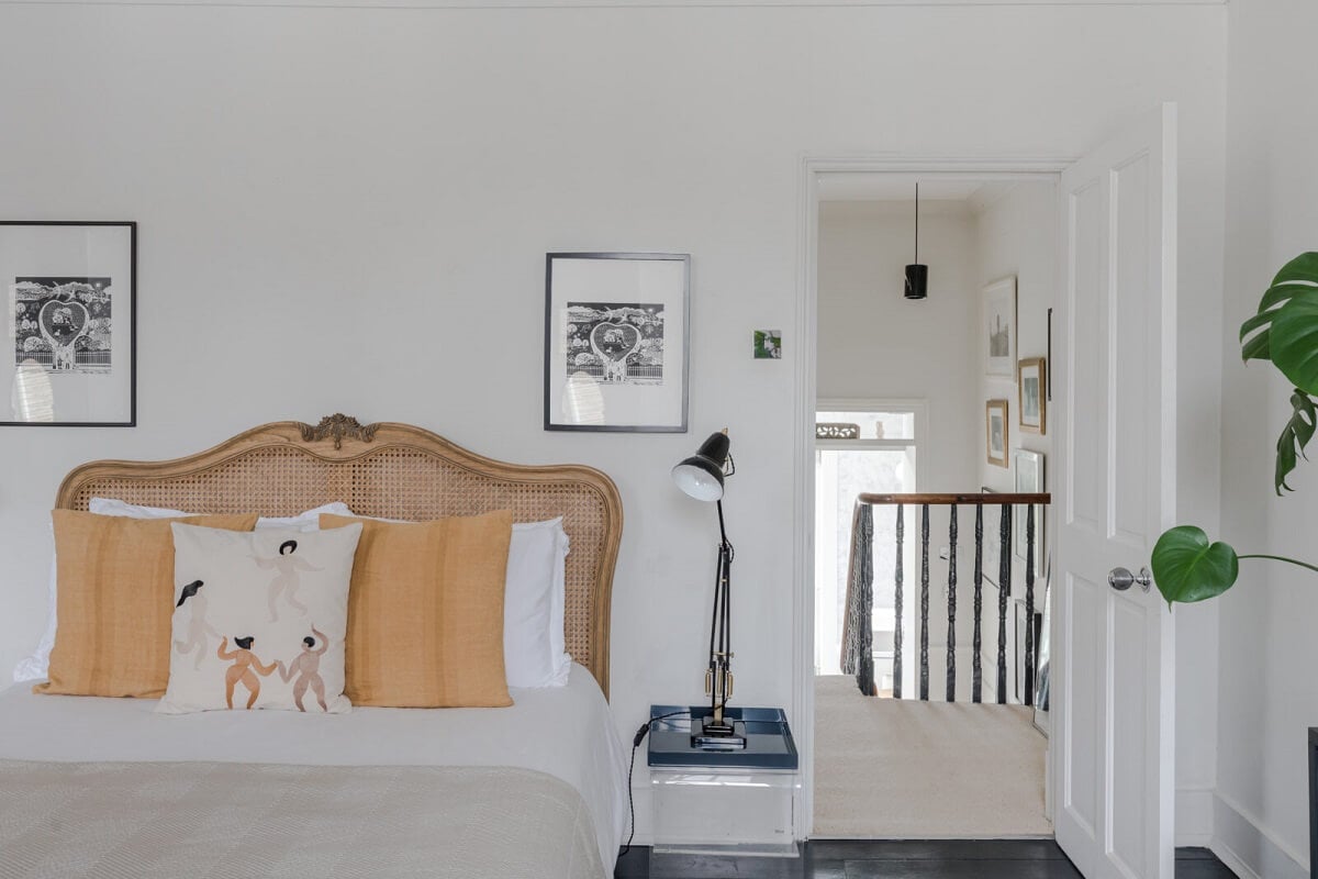 A Bright Extended and Renovated Victorian House in London 15 white bedroom with cane headboard