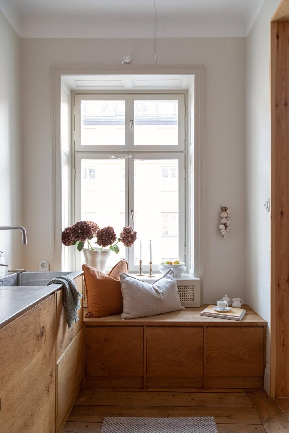 A Turn-of-the-Century Apartment with Warm Open-Plan Spaces 15 window seat kitchen