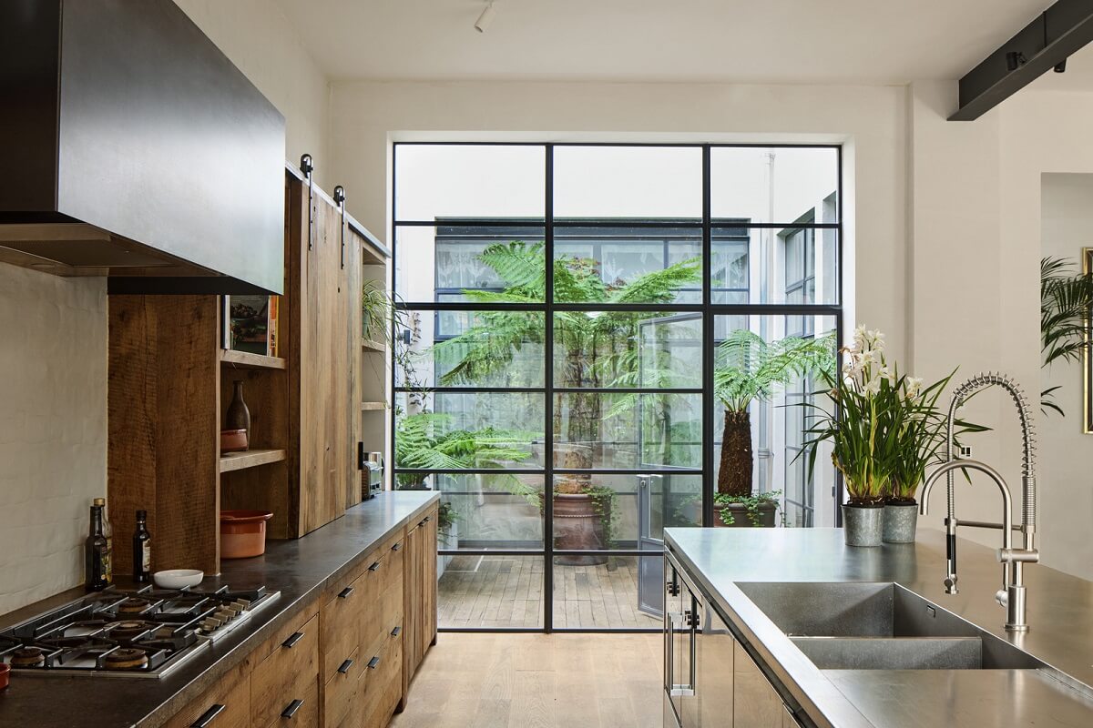 A Grand Industrial Warehouse Conversion in London 4 wood steel kitchen