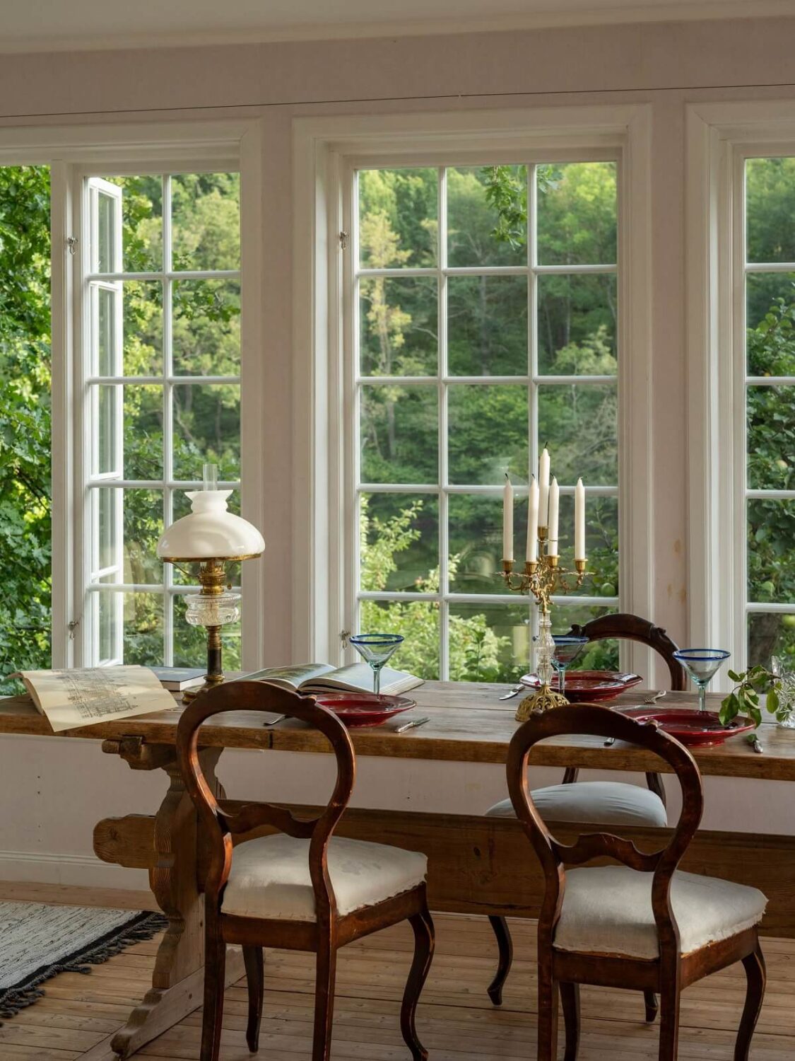 A Romantic 1920s Villa with Views of the Lake 8 wooden dining table