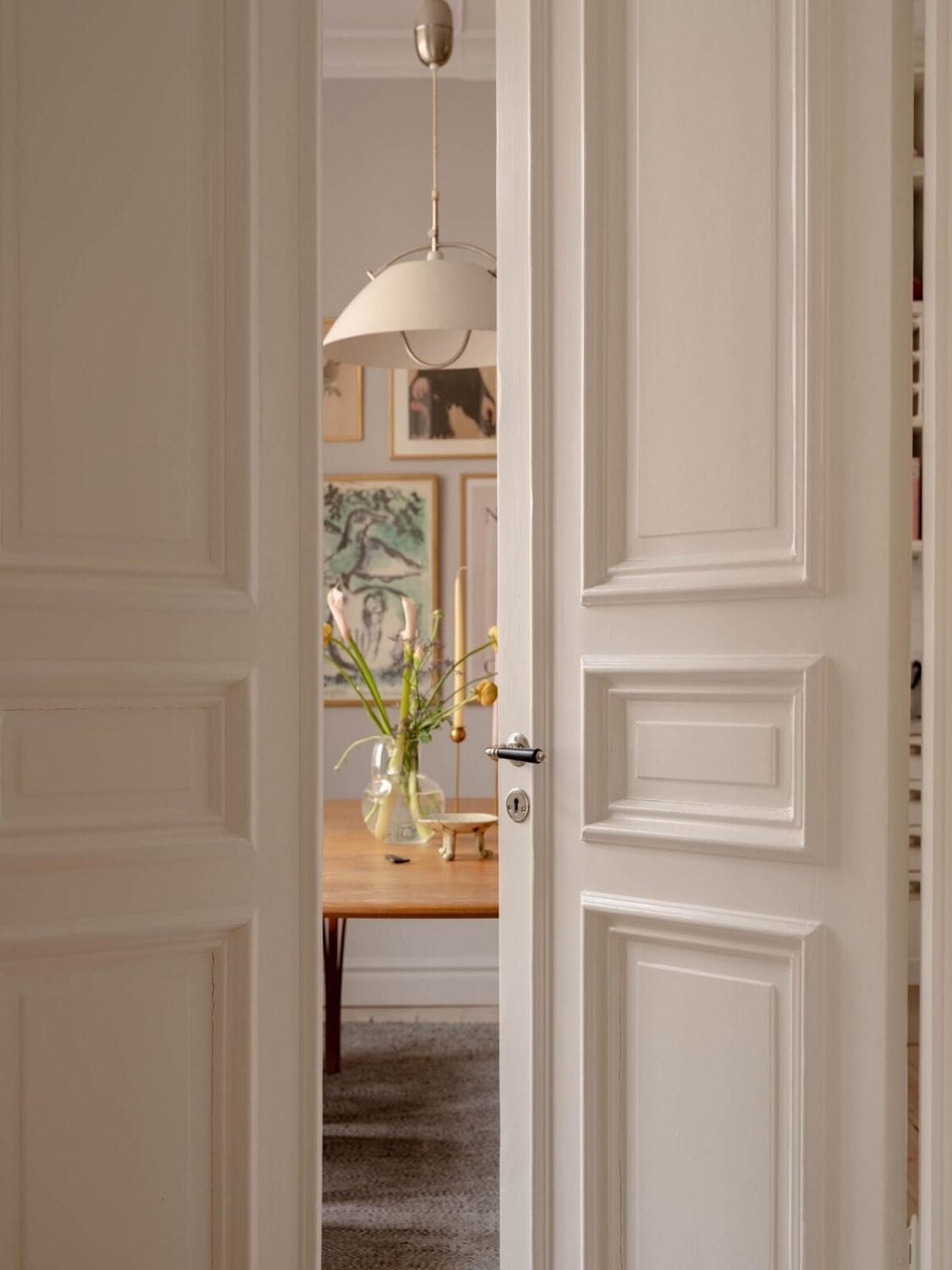 A Spacious Stockholm Apartment with Light Gray Walls 8 wooden doors