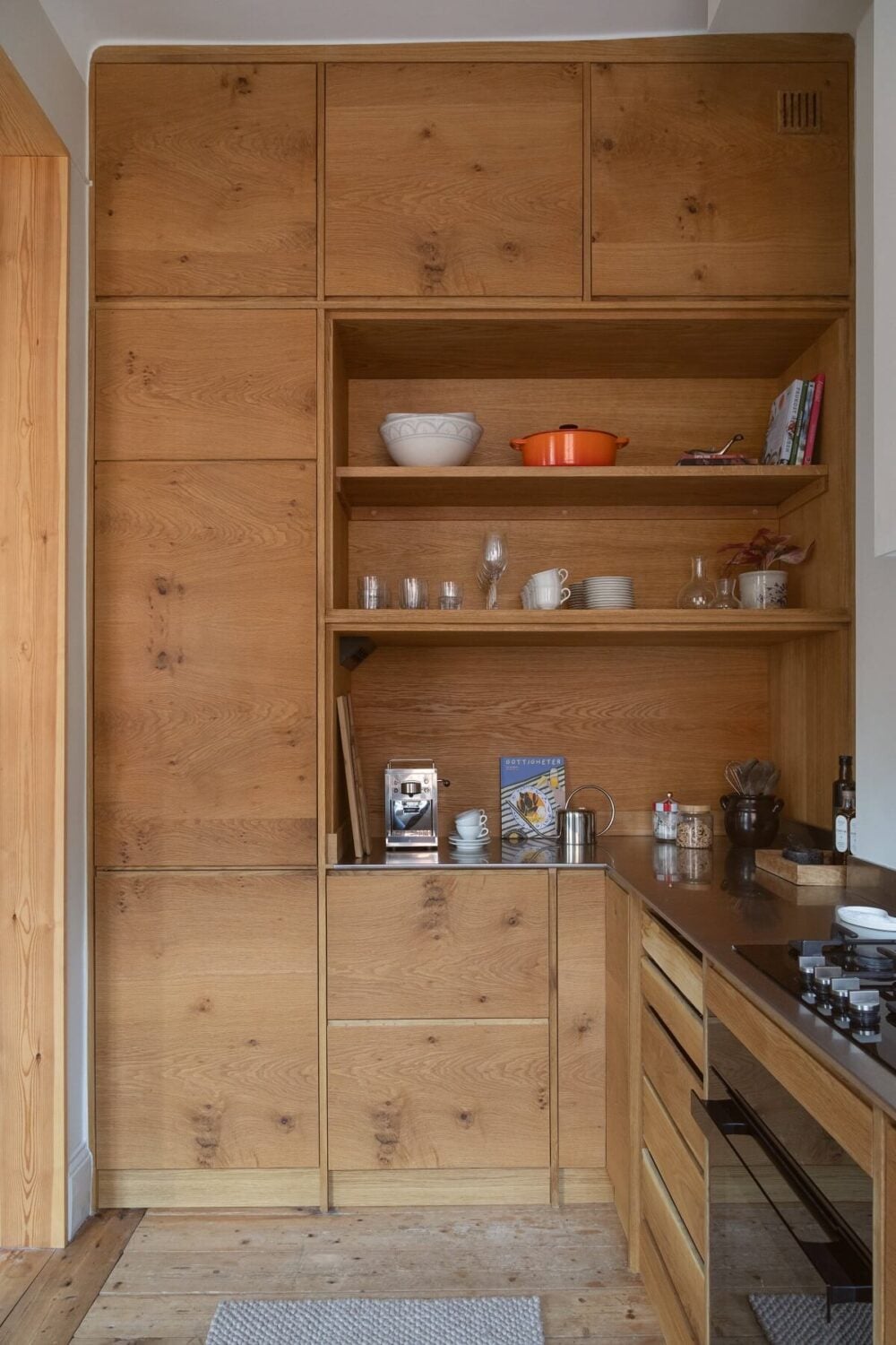 A Turn-of-the-Century Apartment with Warm Open-Plan Spaces 16 wooden kitchen with floor to ceiling cabinets and shelves