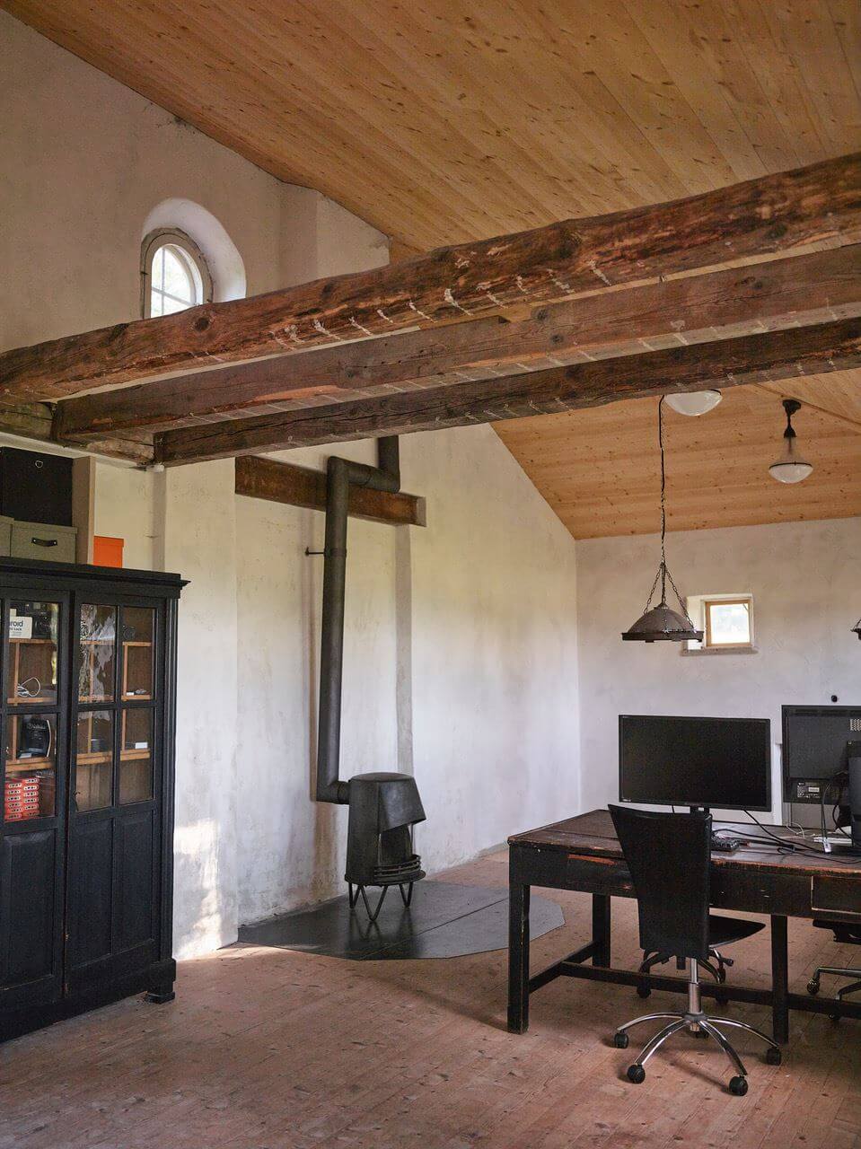 A Bohemian-Style House on the Estate of a Swedish Castle 31 workspace exposed beams