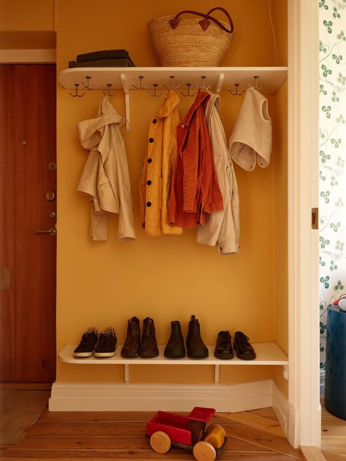 A Light Turn-of-the-Century Apartment with a Cheerful Color Palette 22 yellow hallway