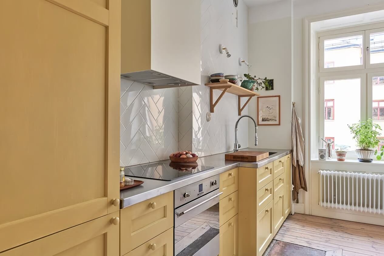 A Light Swedish Apartment with a Yellow Kitchen 15 yellow kitchen