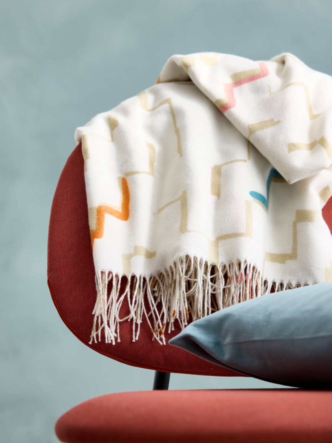 IKEA Spring Collection 2025: Colorful Textiles, Clean Designs & Home Refresh Ideas 10 throw hanging over terracotta chair
