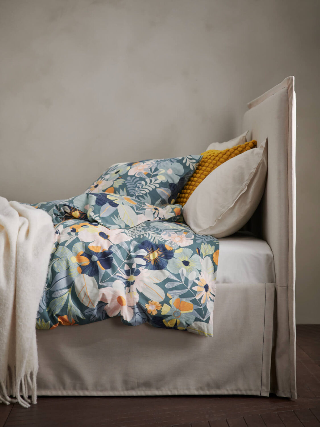 IKEA Spring Collection 2025: Colorful Textiles, Clean Designs & Home Refresh Ideas 2 bed from the side with textured headboard and floral bedding