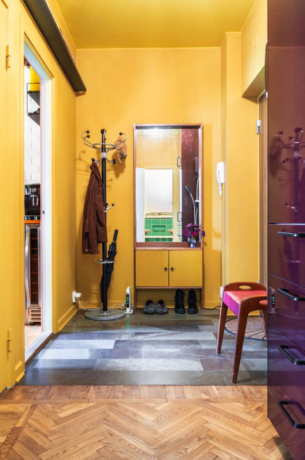 A Vibrant, Colorful Midcentury Apartment in Malmö 21 a sunny yellow color drenched hallway nordroom A Vibrant, Colorful Midcentury Apartment in Malmö