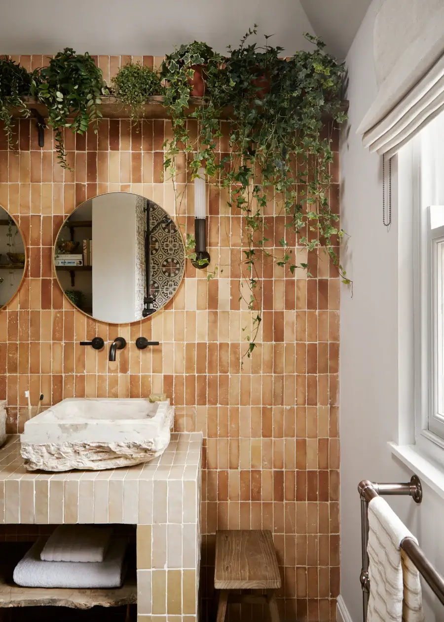 The Color Trends for 2025: Warm, Natural Shades and a Cheerful Accent 81 bathroom with plants and brown tiles in various hues The Color Trends for 2025: Warm, Natural Shades and a Cheerful Accent