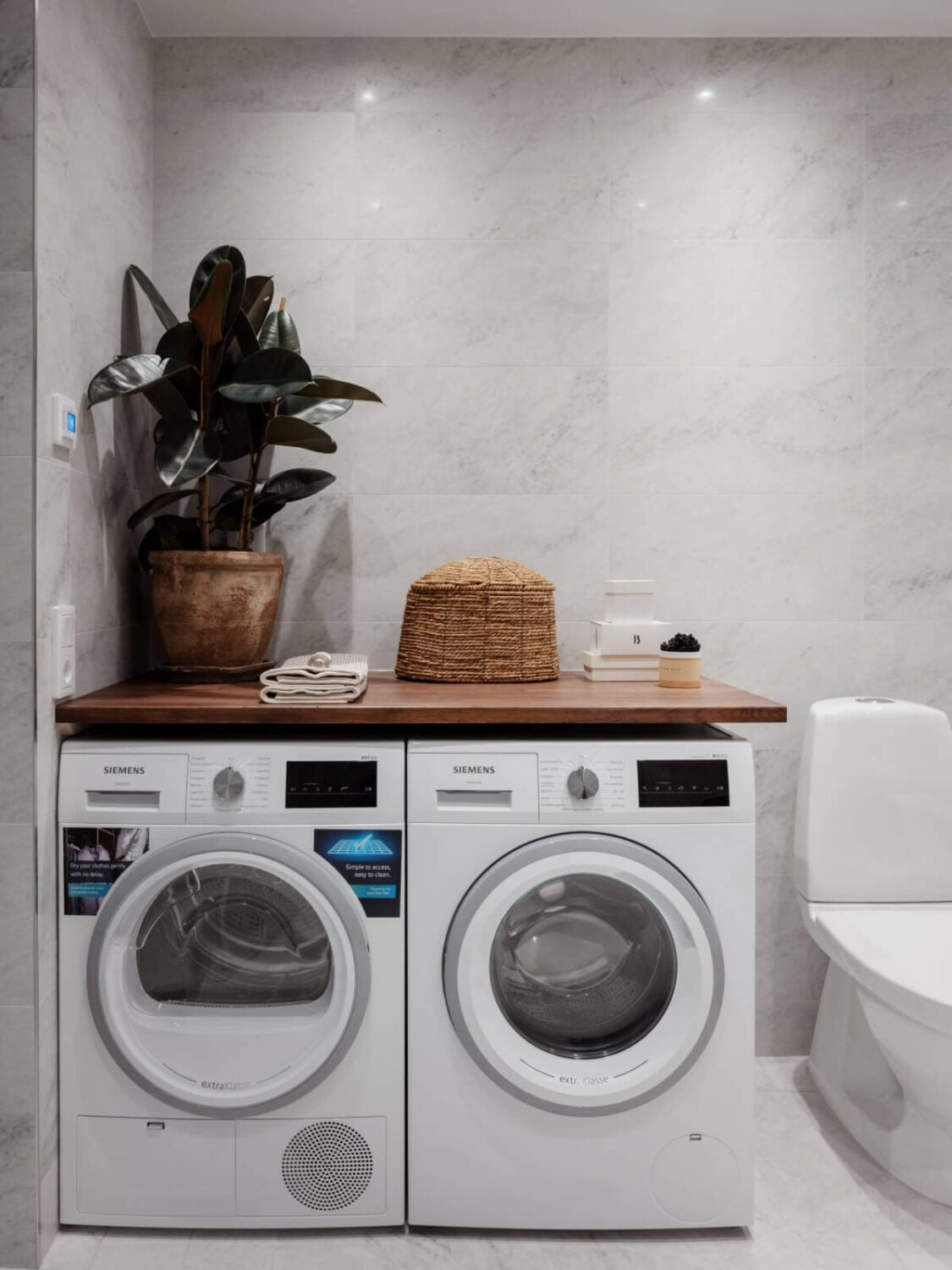 A Calm and Contemporary Apartment in a Former Office Space 24 bathroom with washer and dryer