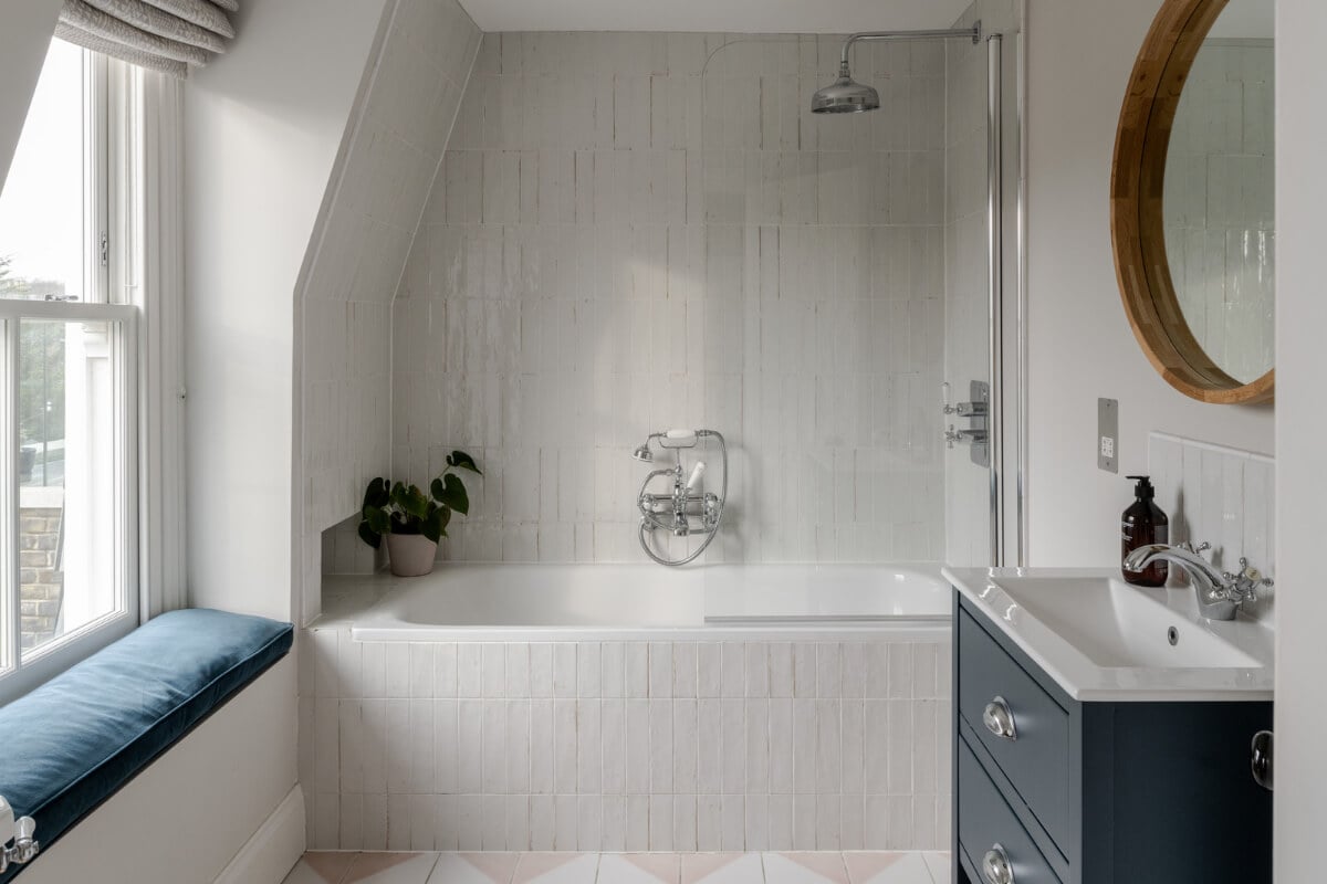 A Beautiful Extended Victorian Family Home in London 20 bathroom with window seat and shower bath combo nordroom