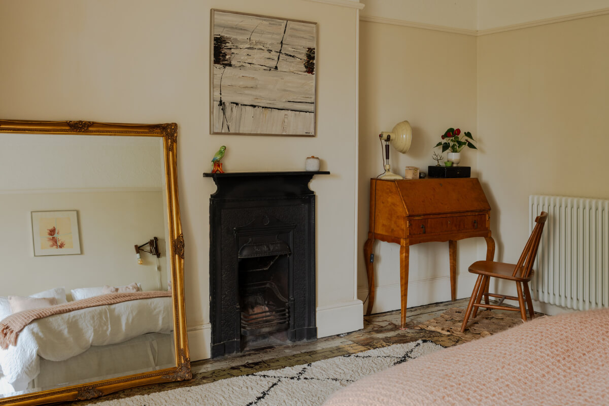 A Strong Color Palette in a Unique Country House in Cornwall 15 bedroom with black fireplace