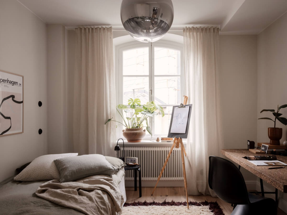 A Calm and Contemporary Apartment in a Former Office Space 21 bedroom with cork desk